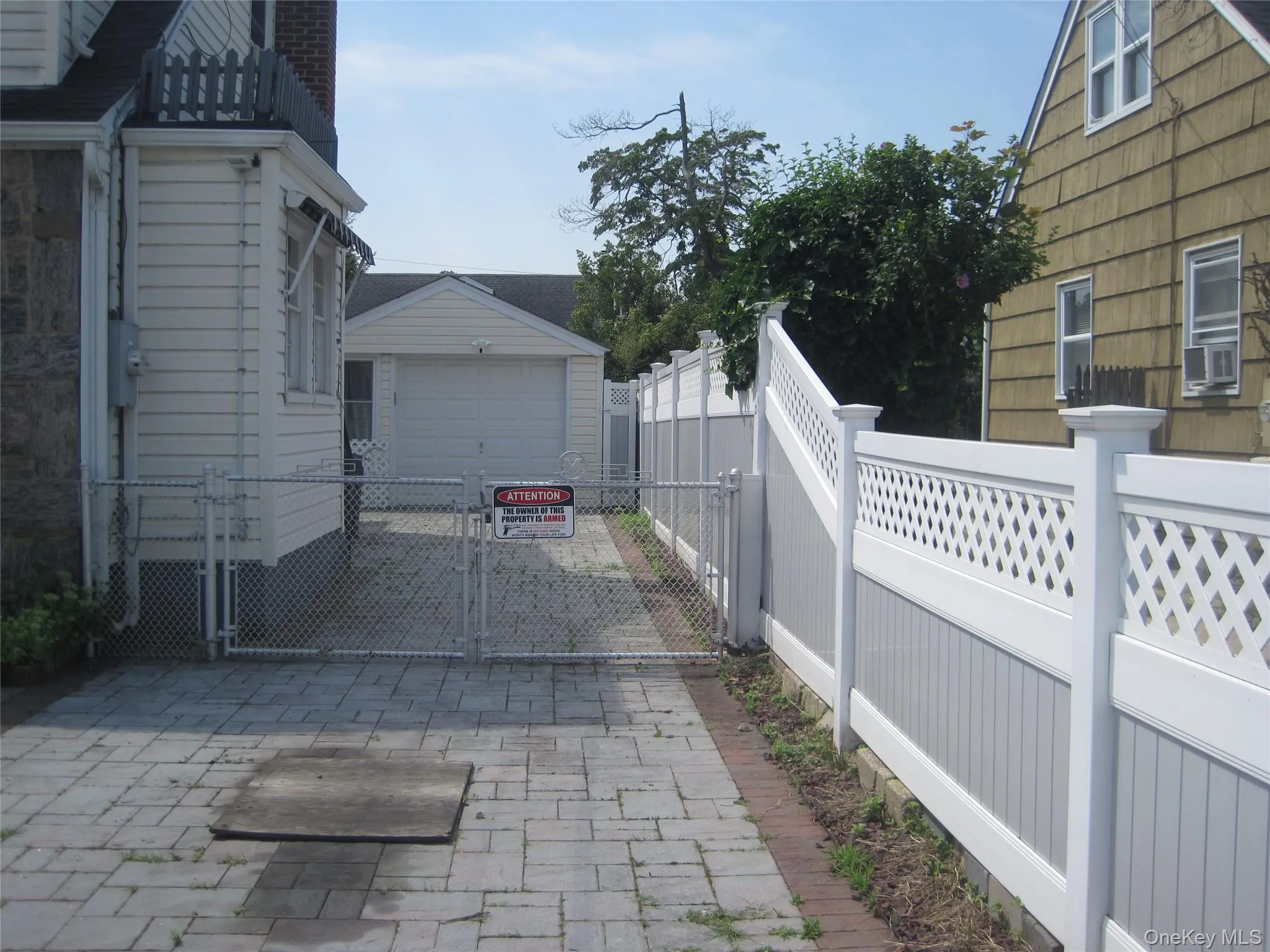 Multiple Car Paved Driveway Leads to Backyard Multiple Car Paved Driveway Leads to Backyard