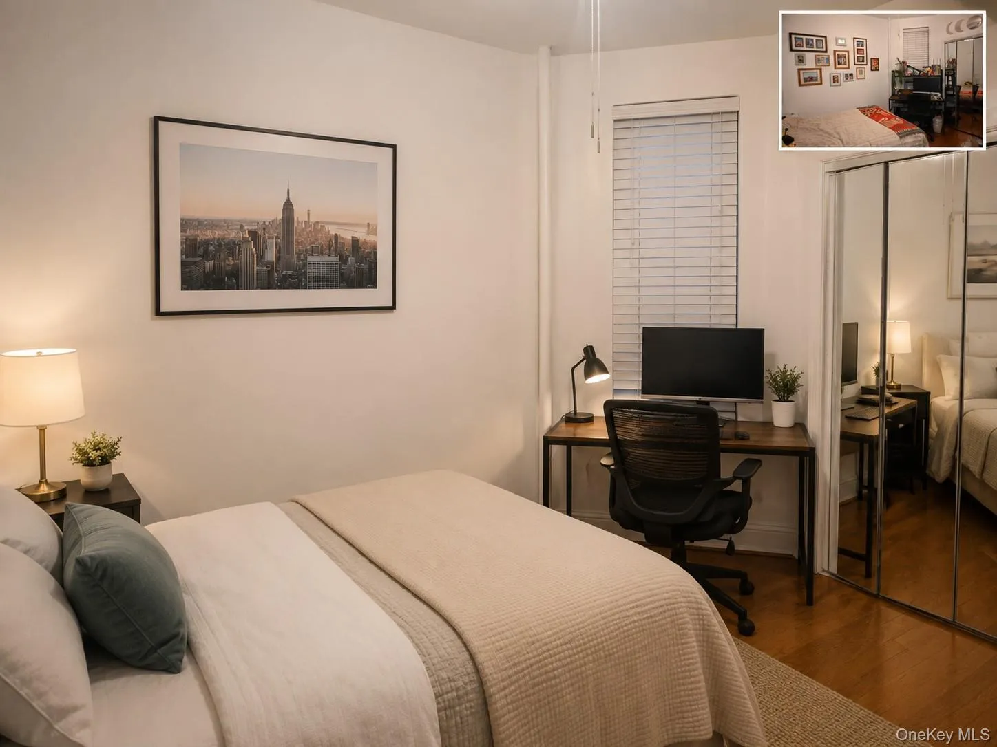Bedroom featuring wood-finish flooring, a window with horizontal blinds, and mirrored wardrobe doors (virtually staged) Bedroom featuring wood-finish flooring, a window with horizontal blinds, and mirrored wardrobe doors (virtually staged)