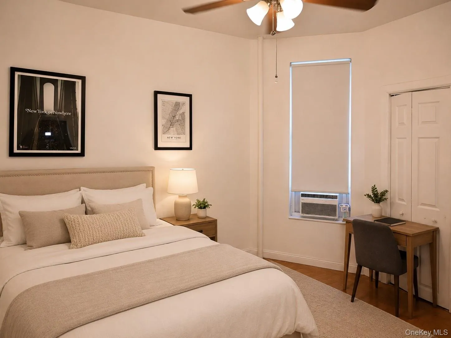 Bedroom featuring a ceiling fan with integrated lighting, wood-finish flooring, and a window with a roller blind (virtually staged) Bedroom featuring a ceiling fan with integrated lighting, wood-finish flooring, and a window with a roller blind (virtually staged)