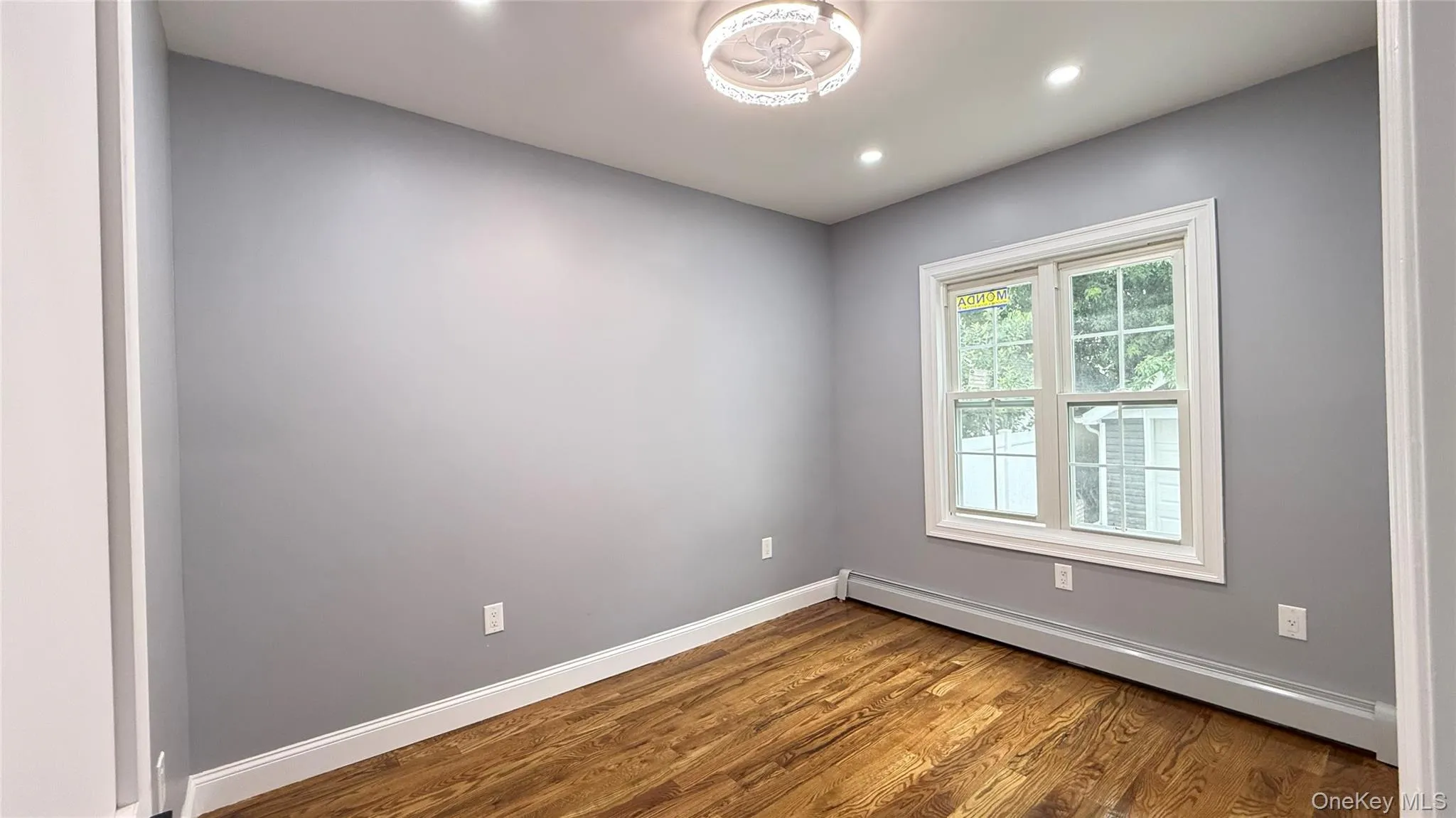 Hardwood flooring complemented by gray walls and white trim Hardwood flooring complemented by gray walls and white trim