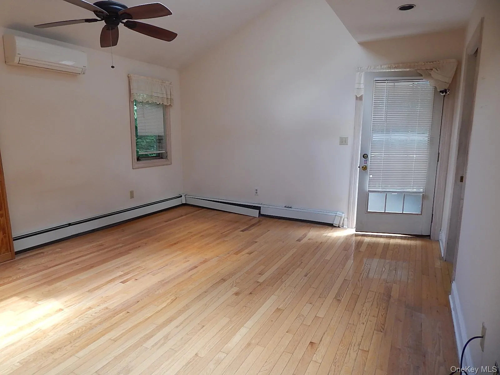 The primary bedroom has access to a deck. The primary bedroom has access to a deck.