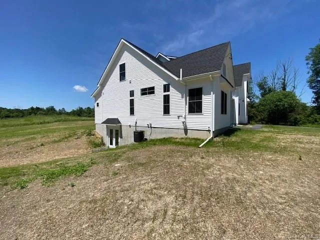This impressive side view showcases the home’s generous yard, expansive outdoor space, and peaceful surroundings, offering a rare combination of privacy, natural beauty, and room to enjoy the outdoors. This impressive side view showcases the home’s generous yard, expansive outdoor space, and peaceful surroundings, offering a rare combination of privacy, natural beauty, and room to enjoy the outdoors.