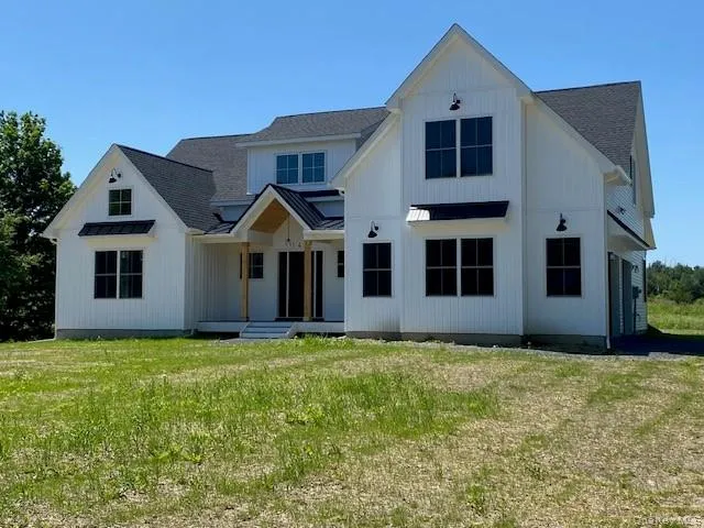 Designed for year-round enjoyment, the covered porch provides shelter, comfort, and charming curb appeal. Designed for year-round enjoyment, the covered porch provides shelter, comfort, and charming curb appeal.