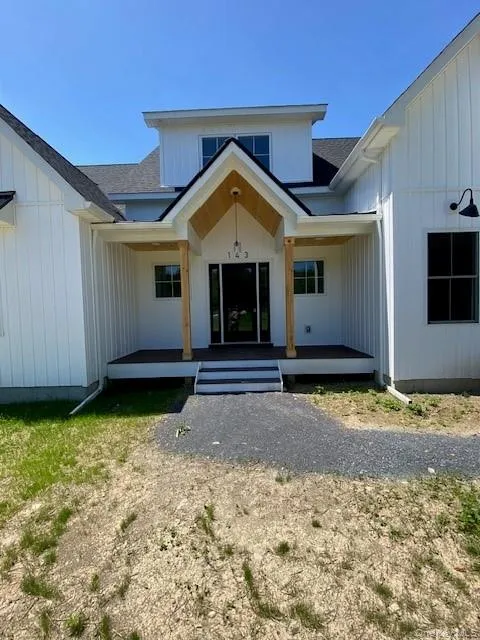 The covered porch extends the home’s living space outdoors, creating an inviting setting for conversation and relaxation. The covered porch extends the home’s living space outdoors, creating an inviting setting for conversation and relaxation.