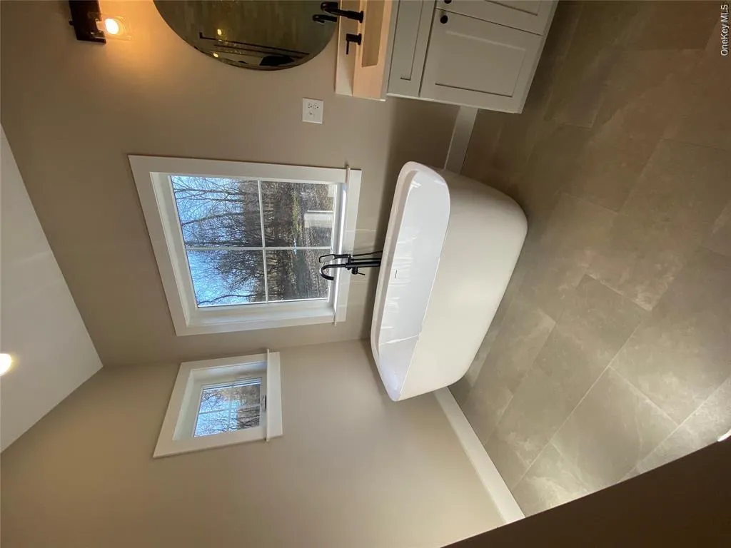 A large free standing soaking tub creates a relaxing sanctuary designed for comfort and tranquility. A large free standing soaking tub creates a relaxing sanctuary designed for comfort and tranquility.