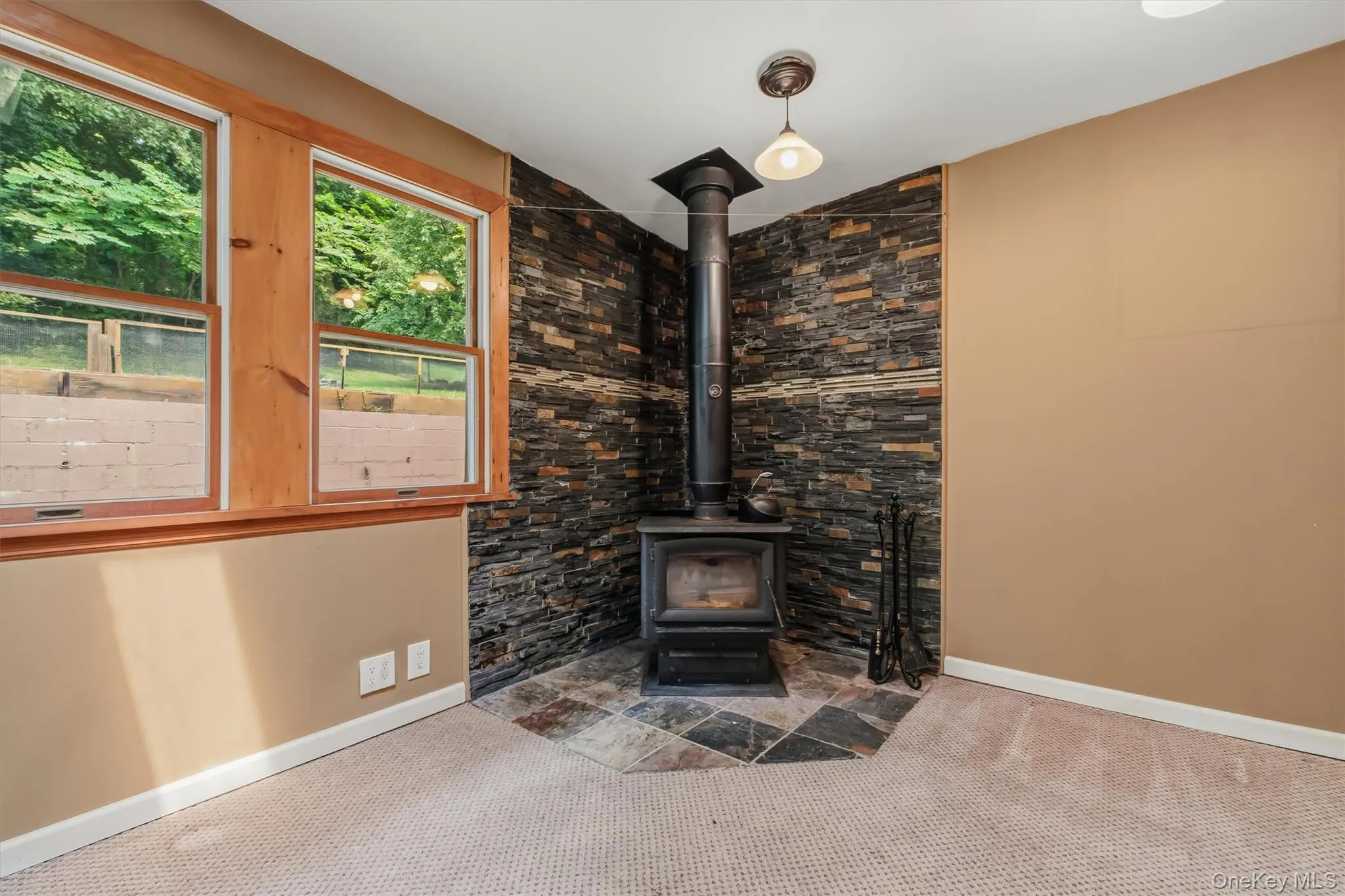 Wood burning stove w/tiled hearth. Wood burning stove w/tiled hearth.
