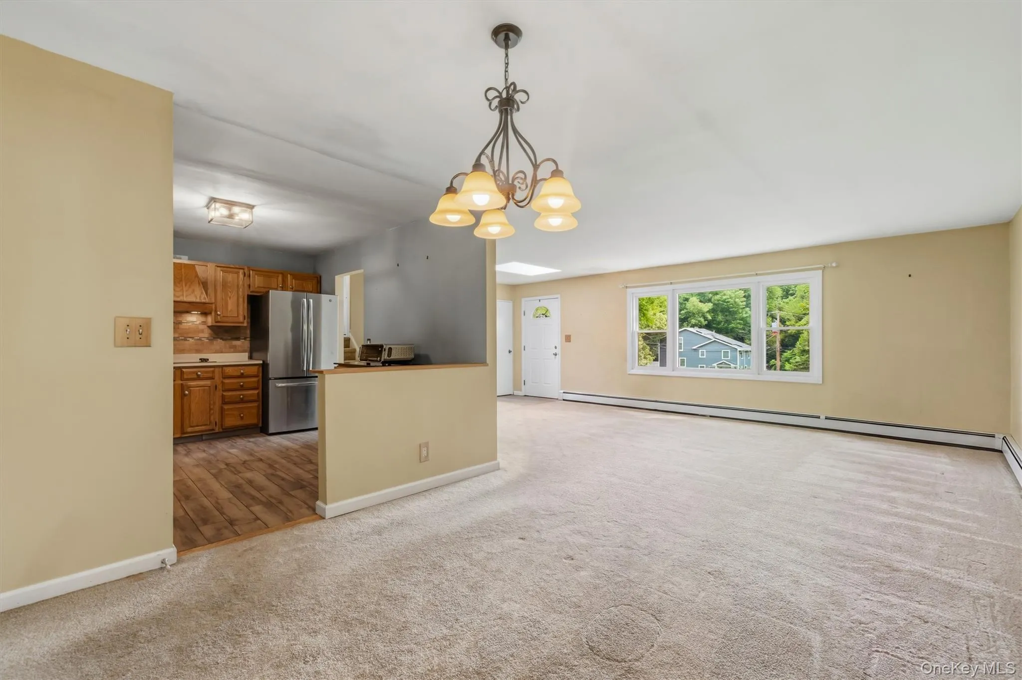 View of dining area to living room w/open kitchen View of dining area to living room w/open kitchen