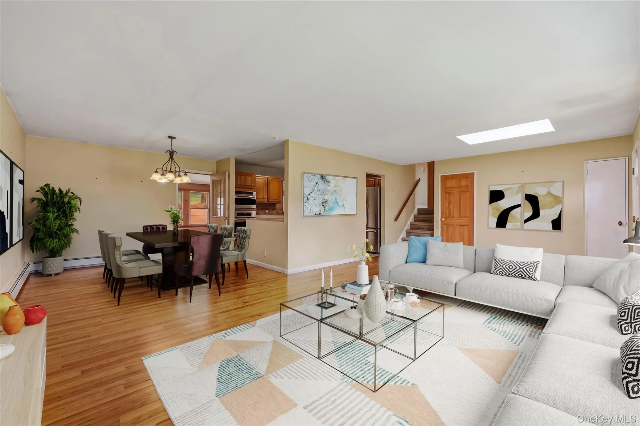Large open space - view of living room to dining area - great for entertainment (VIRTUALLY STAGED) Large open space - view of living room to dining area - great for entertainment (VIRTUALLY STAGED)