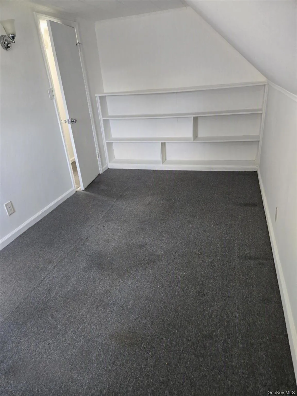 Bedroom with built in shelves. Bedroom with built in shelves.