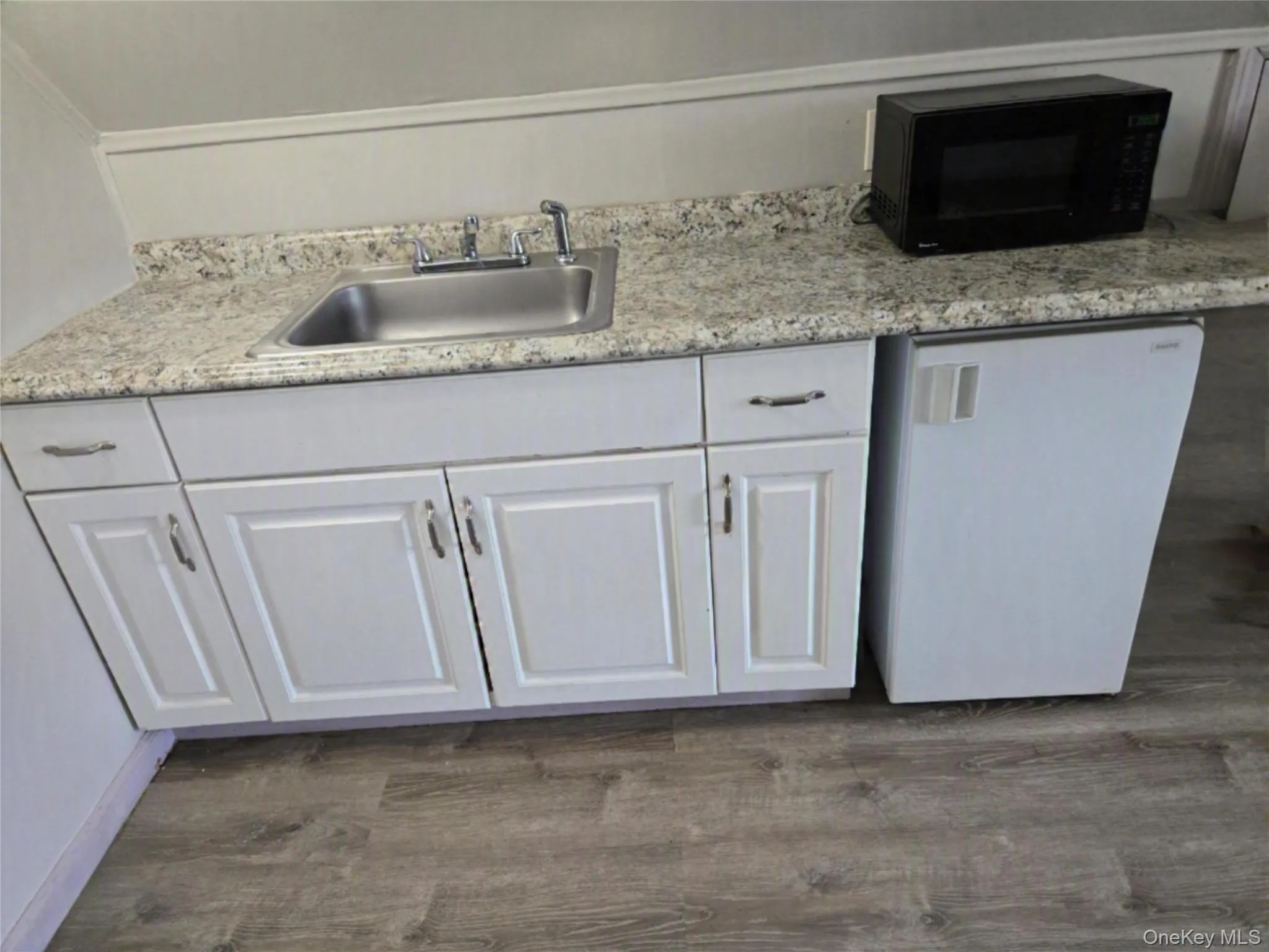Kitchen with microwave and bonus mini refrigerator. Kitchen with microwave and bonus mini refrigerator.