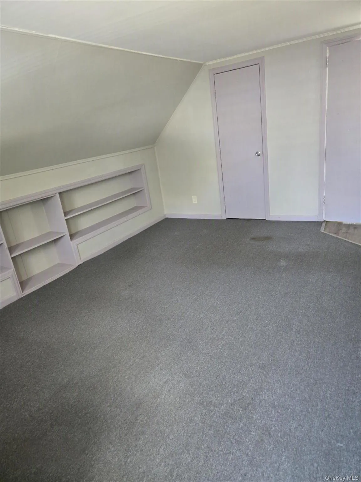 living / dining area with built in shelves. living / dining area with built in shelves.