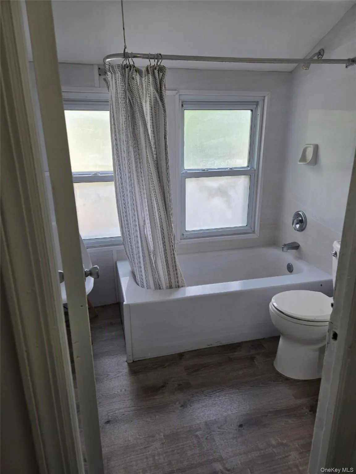 Bathroom with shower and windows. Bathroom with shower and windows.
