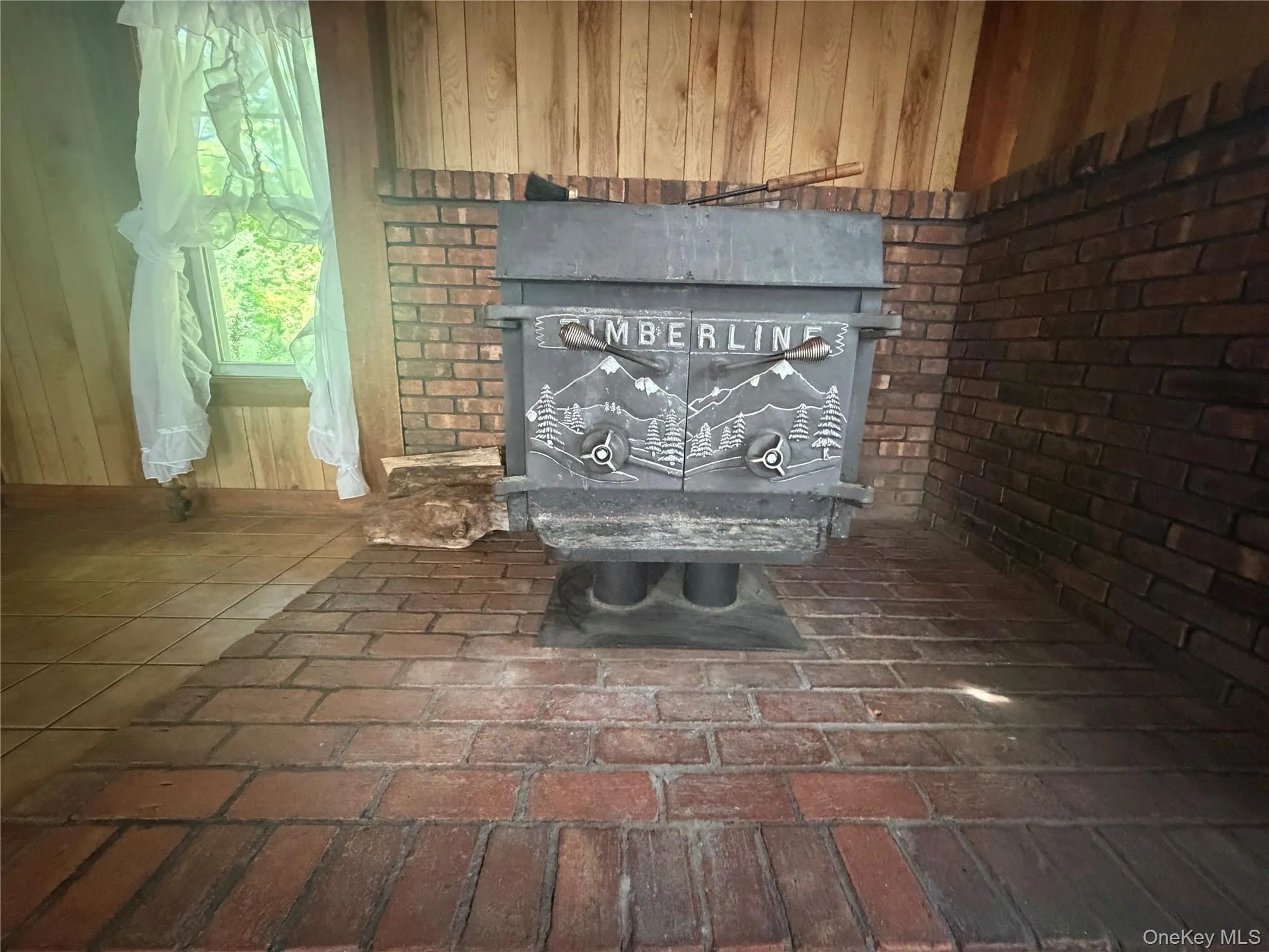 A large wood stove helps with heating the home A large wood stove helps with heating the home