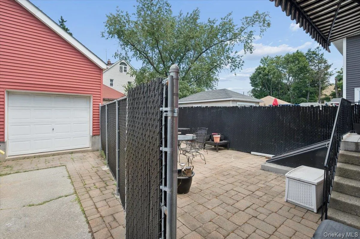 Detached garage for storage. Backyard view leading to the kitchen Detached garage for storage. Backyard view leading to the kitchen