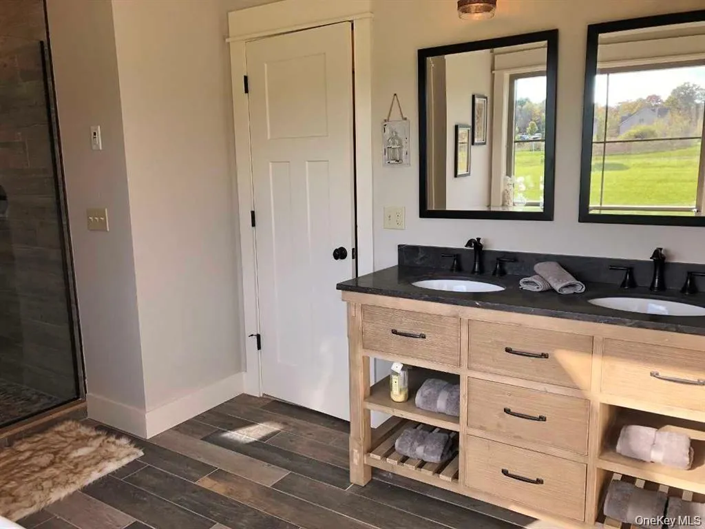 A dual-sink vanity provides added convenience whole offering ample storage for daily essentials. A dual-sink vanity provides added convenience whole offering ample storage for daily essentials.