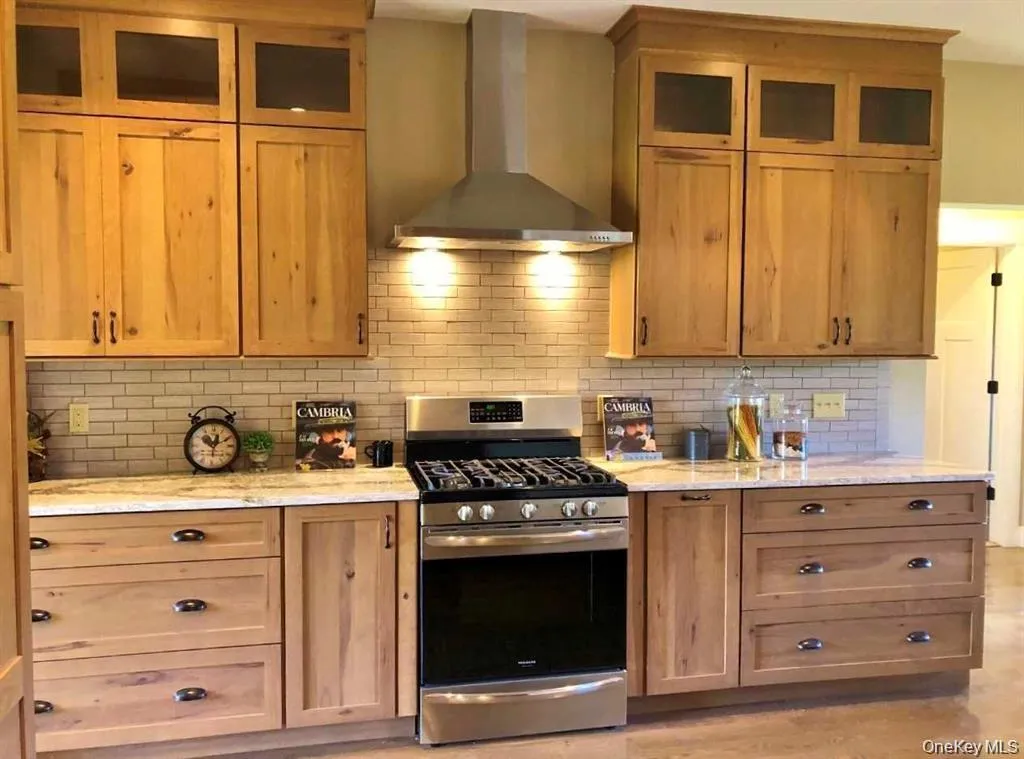 Thoughtfully arranged cabinetry and workspace combine practicality with timeless style in this inviting kitchen. Thoughtfully arranged cabinetry and workspace combine practicality with timeless style in this inviting kitchen.