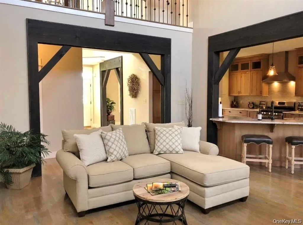 The inviting living room offers a warm gathering space centered around a beautiful fireplace. The inviting living room offers a warm gathering space centered around a beautiful fireplace.