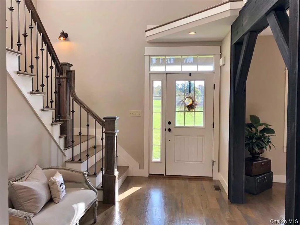 Filled with natural light and enhanced by elegant finishes, the entry foyer sets the tone for the warmth and character found throughout the home. Filled with natural light and enhanced by elegant finishes, the entry foyer sets the tone for the warmth and character found throughout the home.