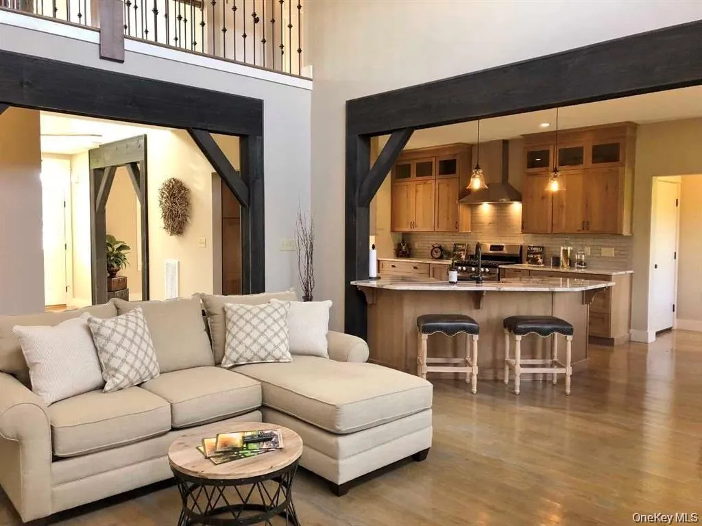 Another view highlights the spacious living area, ideal for relaxing or entertaining. Another view highlights the spacious living area, ideal for relaxing or entertaining.