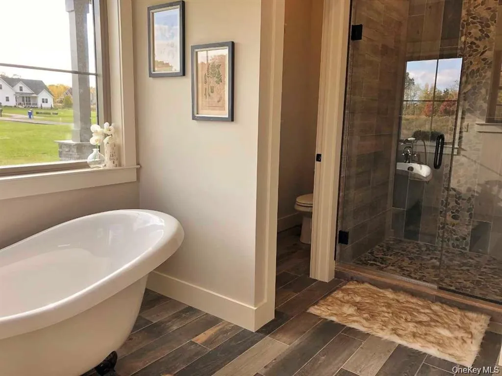The well appointed bathroom features a soaking tub and separate walk in shower for added comfort. The well appointed bathroom features a soaking tub and separate walk in shower for added comfort.