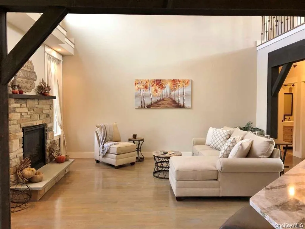 The spacious lower-level family room offers exceptional versatility with direct access to the backyard, garage, laundry area, fourth bedroom, and full bath, creating an ideal space for entertaining, guests, recreation, or extended living needs The spacious lower-level family room offers exceptional versatility with direct access to the backyard, garage, laundry area, fourth bedroom, and full bath, creating an ideal space for entertaining, guests, recreation, or extended living needs