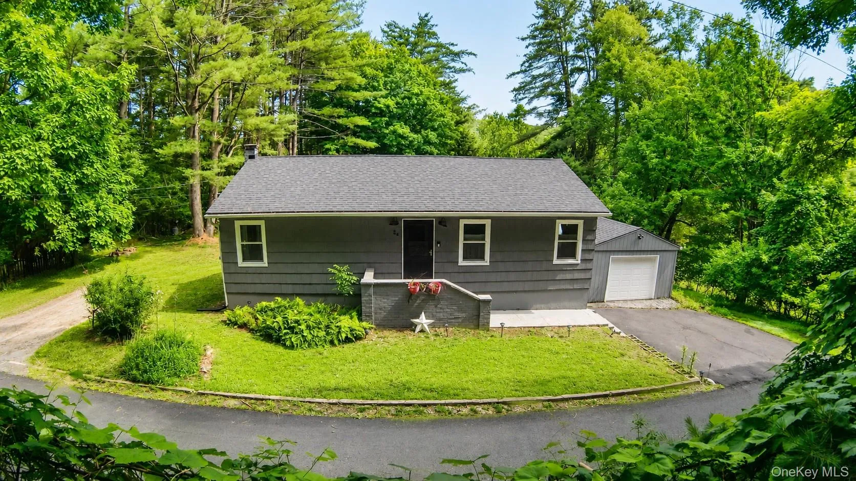 Located on a quiet road with a few homes Located on a quiet road with a few homes