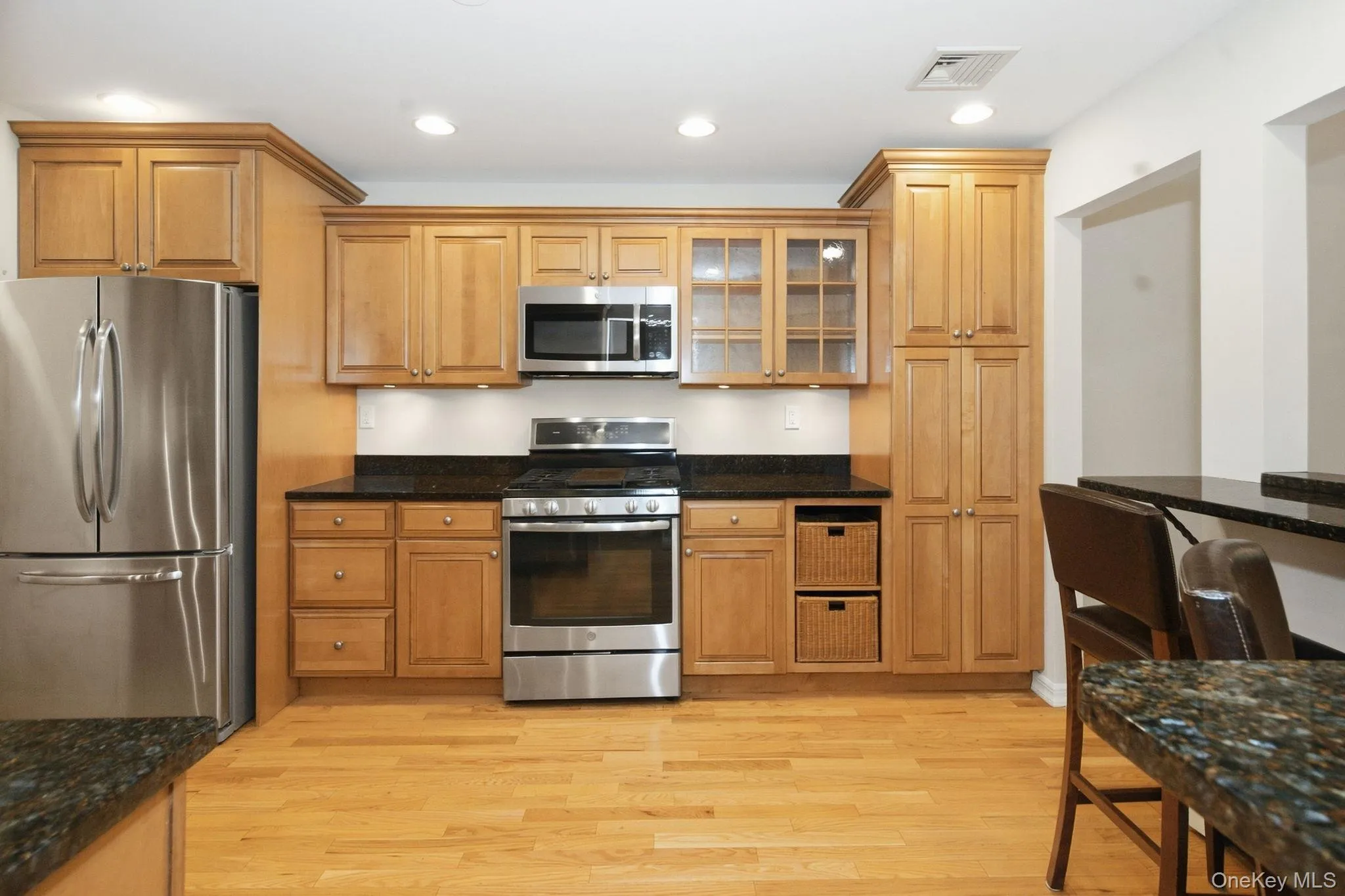 Eat-in kitchen features maple cabinetry, granite countertops and stainless steel appliances. Eat-in kitchen features maple cabinetry, granite countertops and stainless steel appliances.