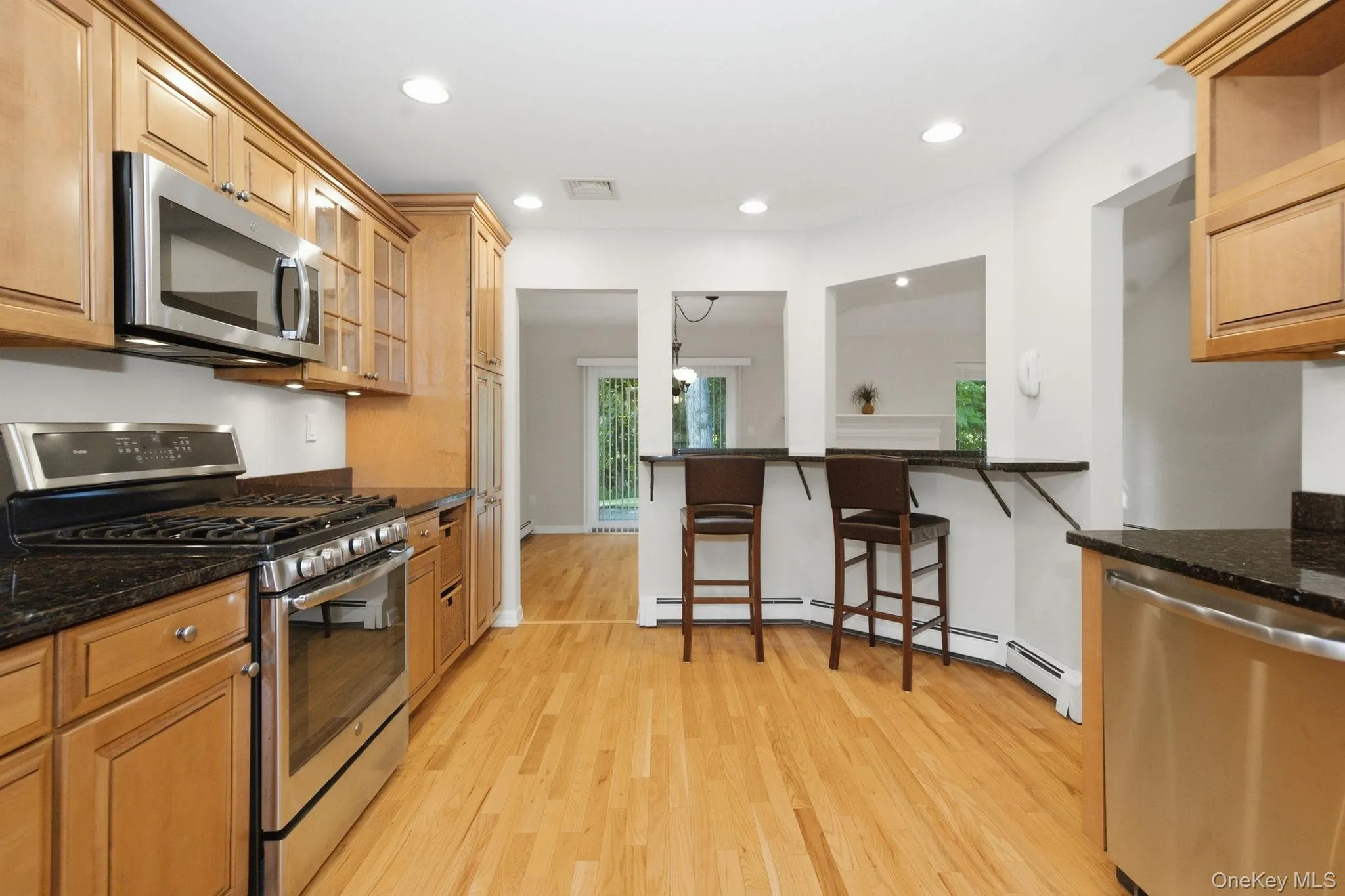 Stainless steel appliances include a French-door refrigerator, range, microwave and dishwasher. Stainless steel appliances include a French-door refrigerator, range, microwave and dishwasher.