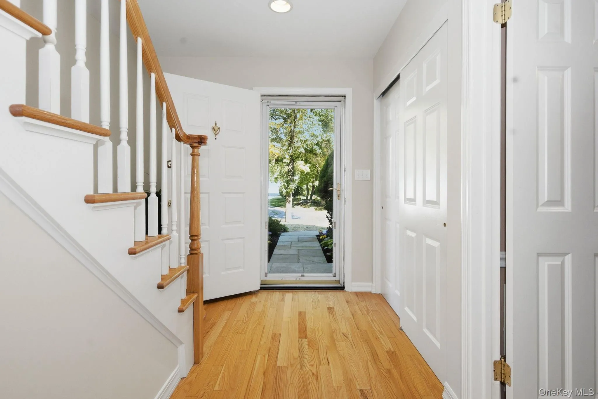 Entry foyer features hardwood flooring and convenient coat storage. Entry foyer features hardwood flooring and convenient coat storage.