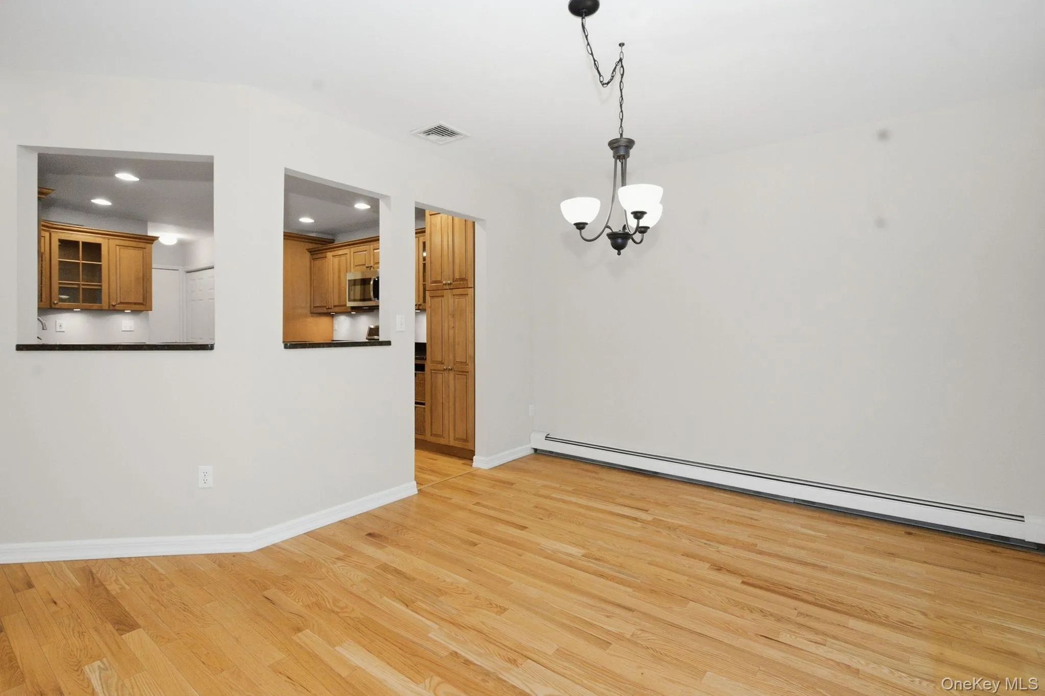Pass-through between the kitchen and living room keeps the main gathering spaces connected. Pass-through between the kitchen and living room keeps the main gathering spaces connected.