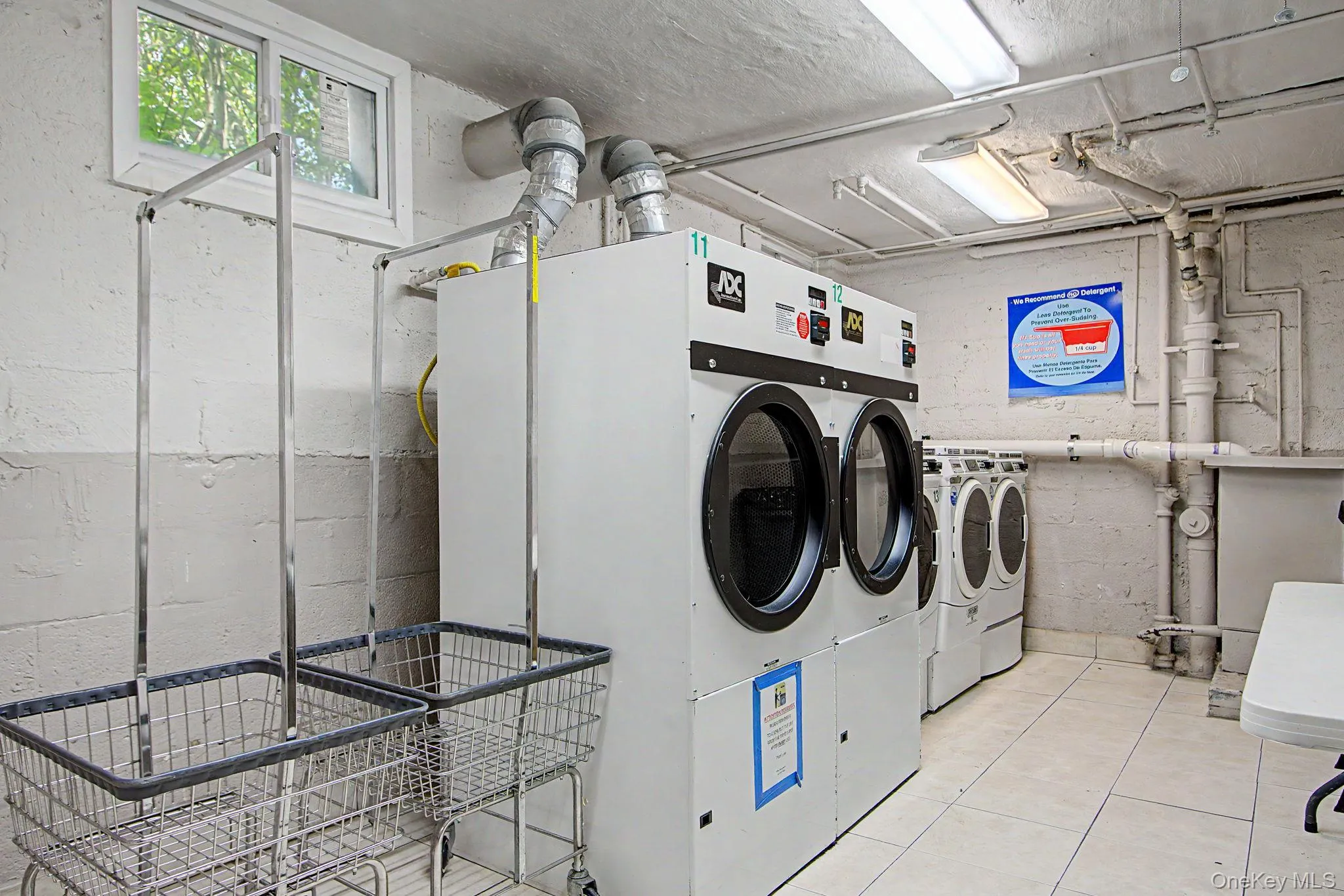 Laundry facility featuring multiple commercial-grade washing machines and dryers Laundry facility featuring multiple commercial-grade washing machines and dryers