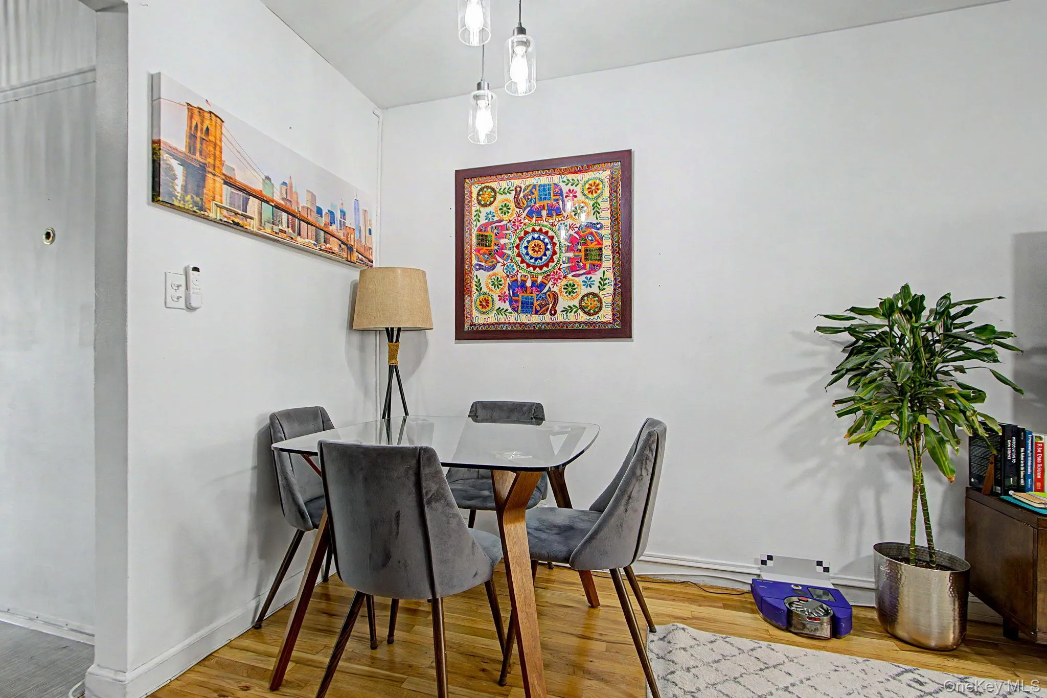 Hardwood-finish flooring complements the white wall finishes Hardwood-finish flooring complements the white wall finishes