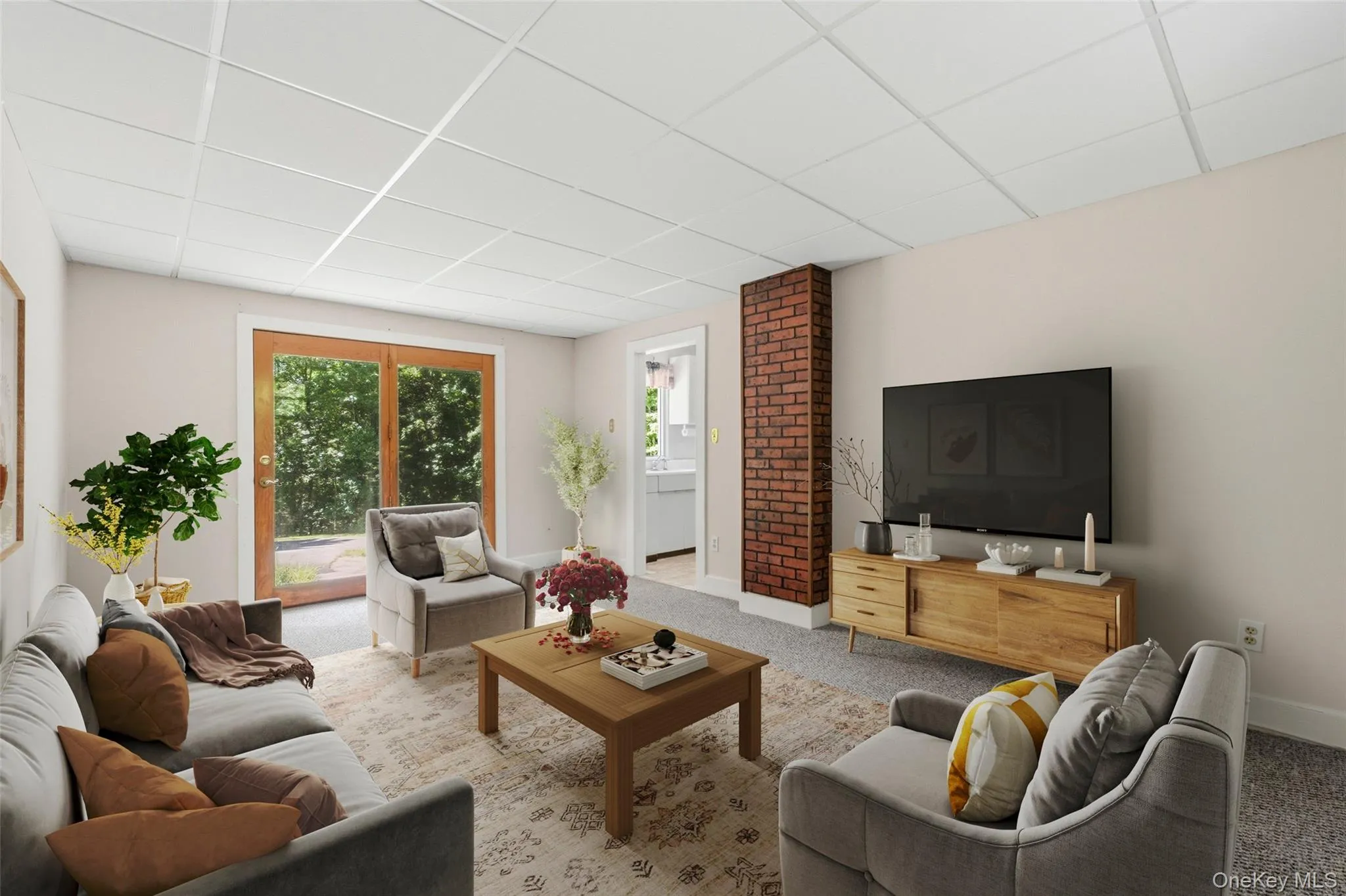 Virtually Staged for Inspo.Spacious living area featuring gorgeous natural light with double doors to the large patio. Neutral carpet. Virtually Staged for Inspo.Spacious living area featuring gorgeous natural light with double doors to the large patio. Neutral carpet.
