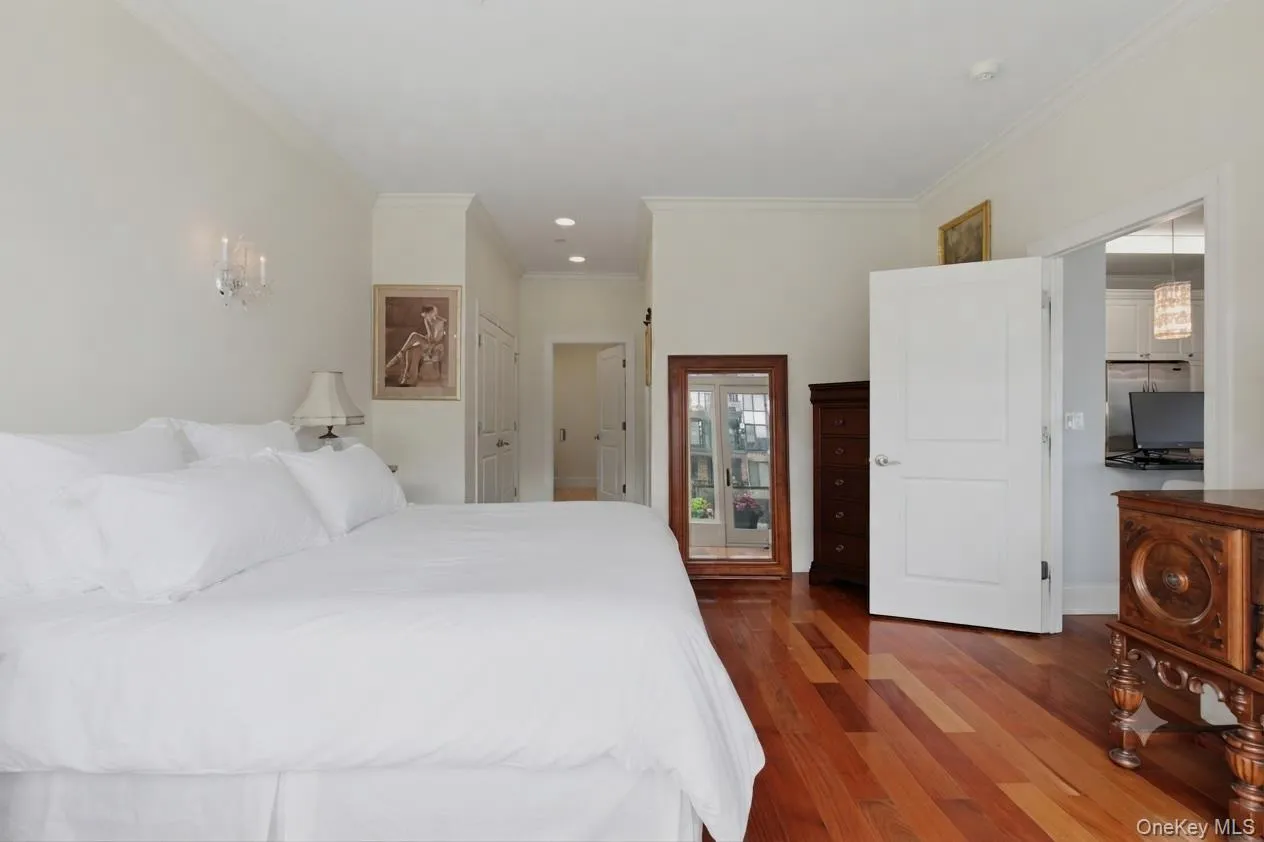 Alternate view of the primary with view of the ensuite bath. (Bedding was virtually staged) Alternate view of the primary with view of the ensuite bath. (Bedding was virtually staged)