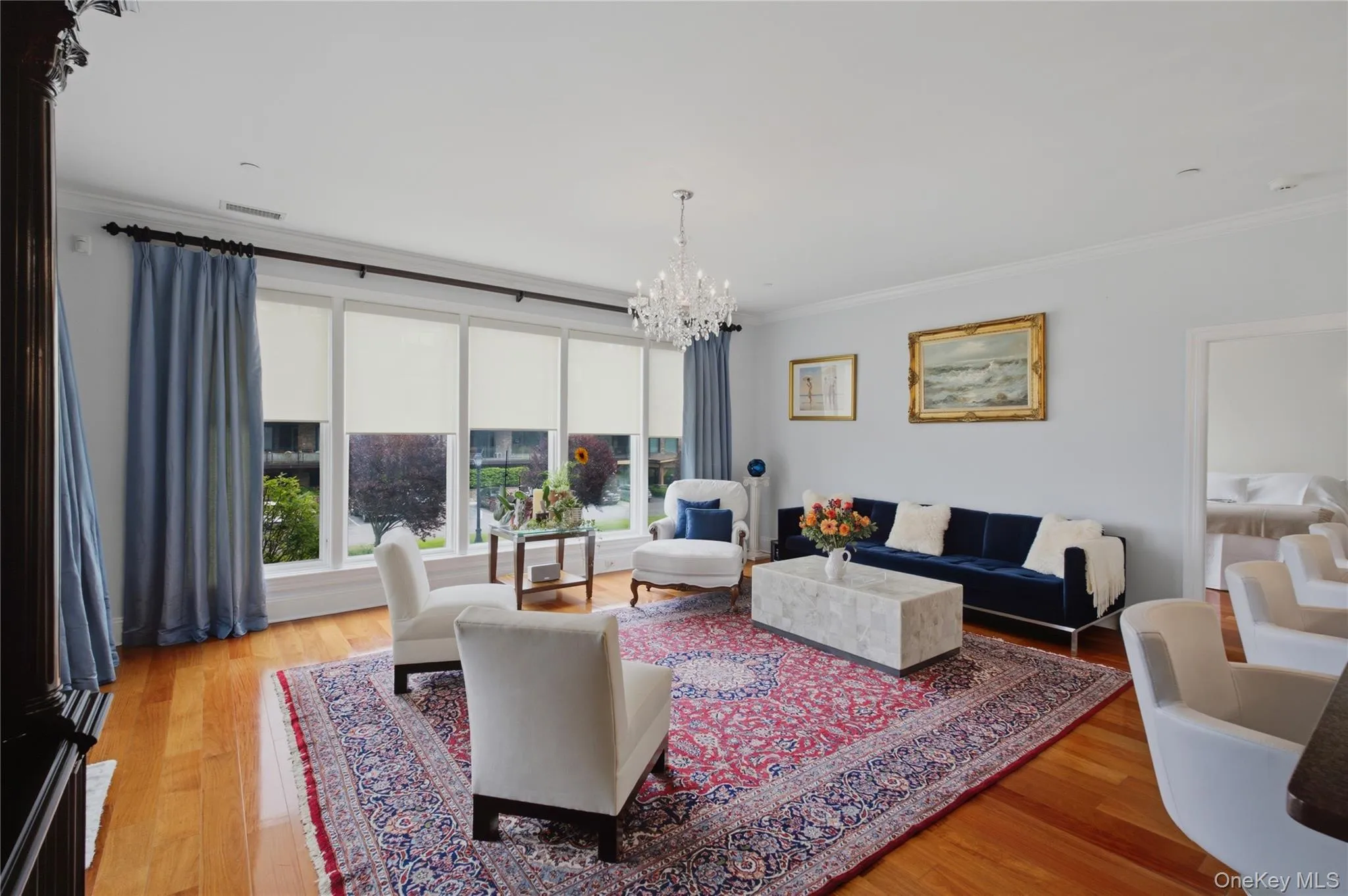 Spacious living room with beautiful large windows creating an airy, open atmosphere Spacious living room with beautiful large windows creating an airy, open atmosphere