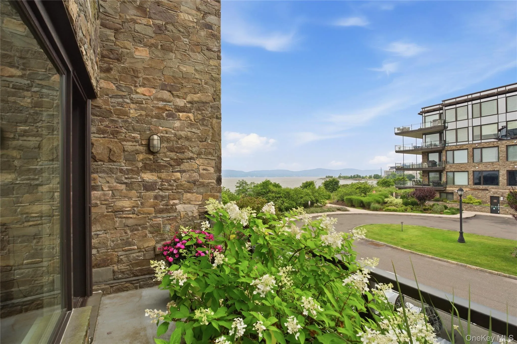 Private balcony off primary suite offering beautiful river views and a peaceful retreat. Private balcony off primary suite offering beautiful river views and a peaceful retreat.