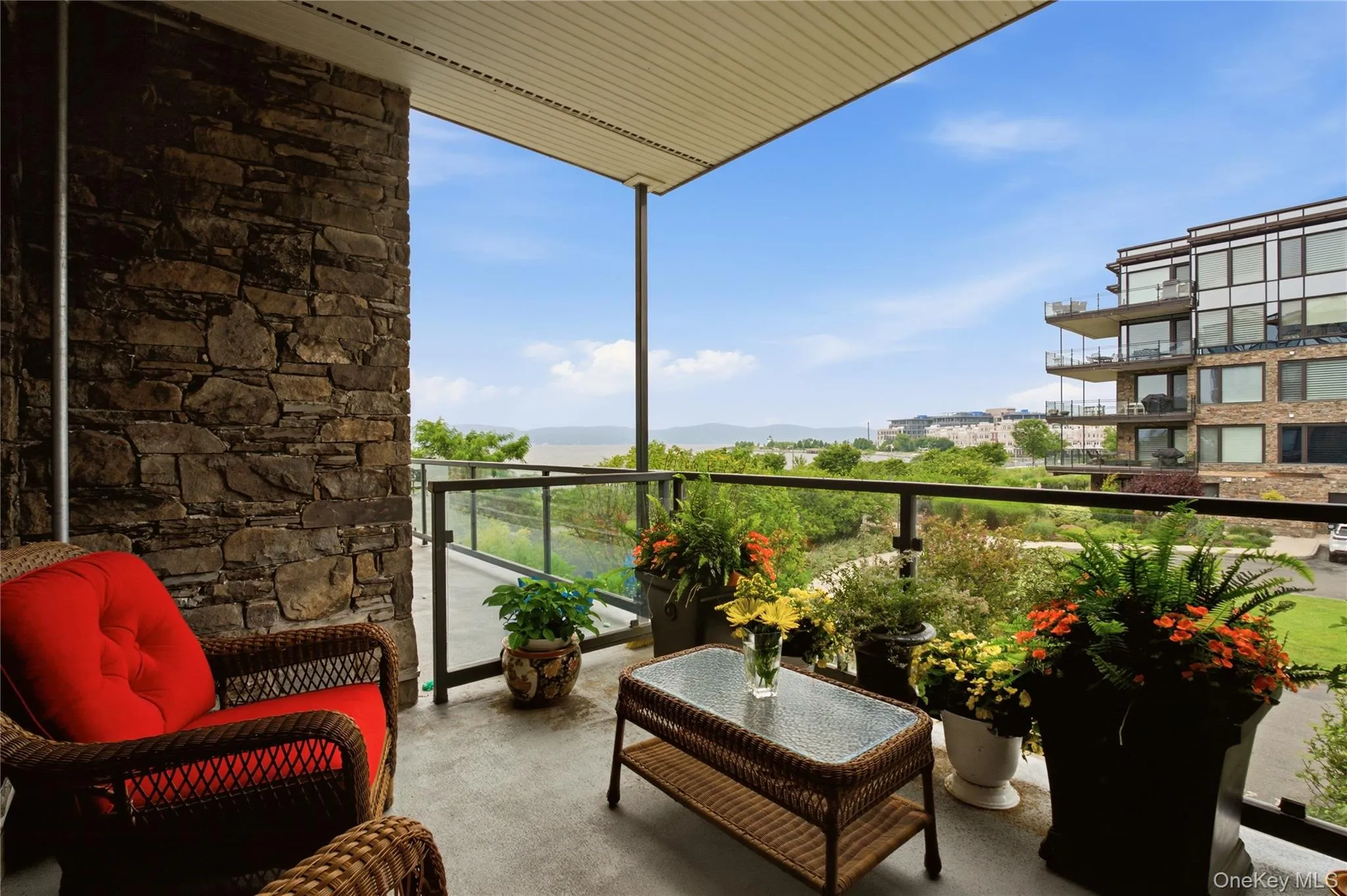 Private balcony off living room featuring beautiful river views and peaceful outdoor retreat. Private balcony off living room featuring beautiful river views and peaceful outdoor retreat.