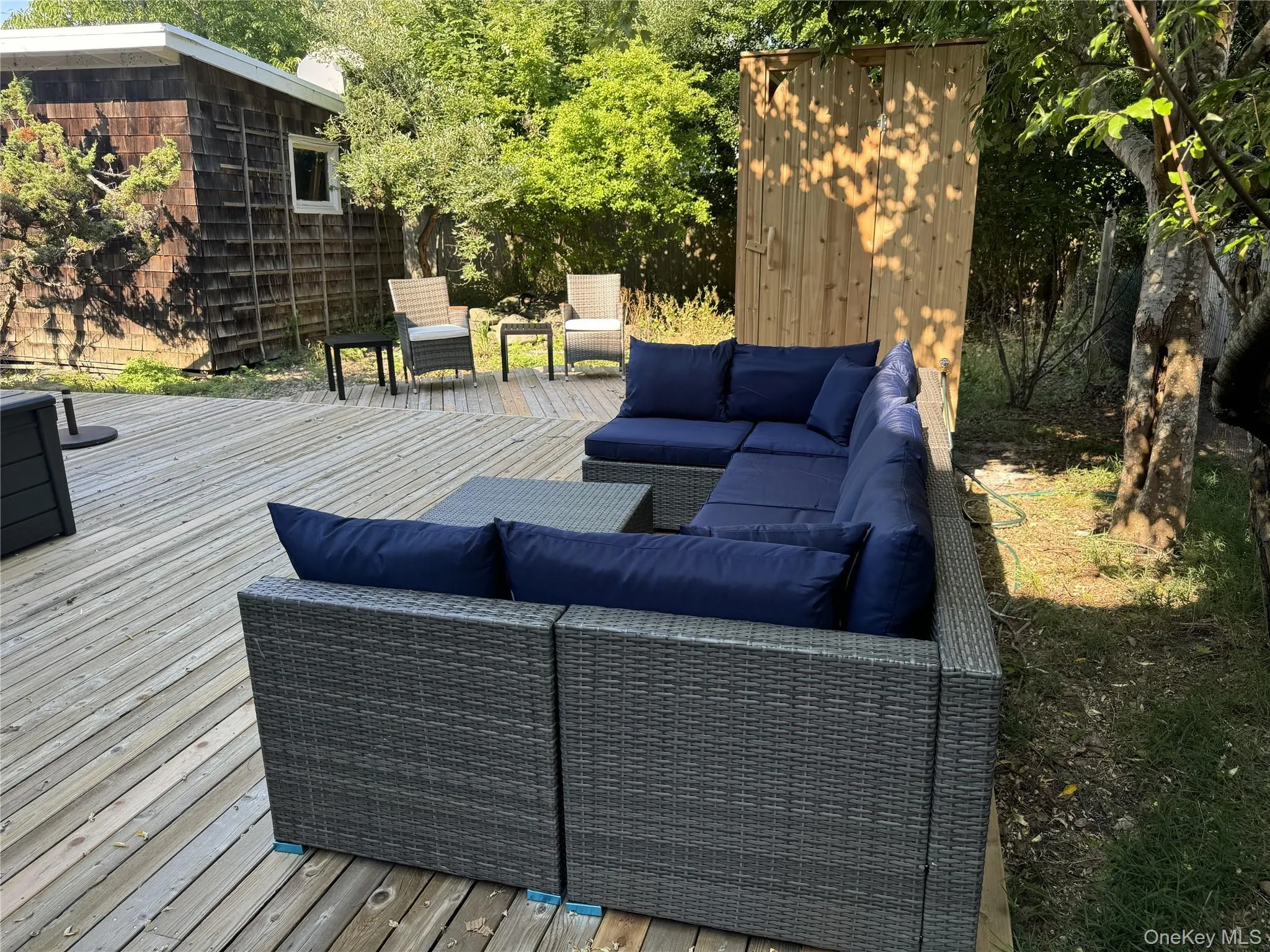 Wooden deck featuring outdoor lounge area Wooden deck featuring outdoor lounge area