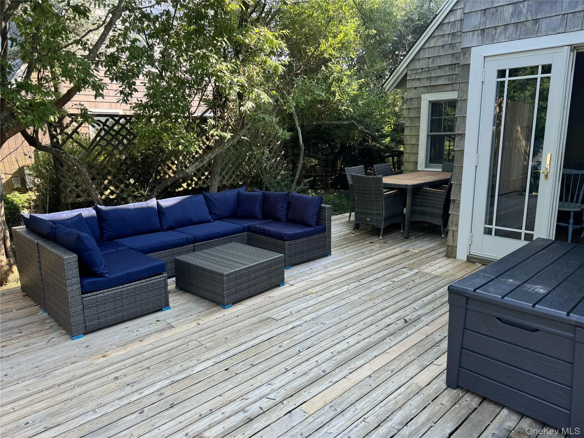 Deck with outdoor lounge area and outdoor dining area Deck with outdoor lounge area and outdoor dining area