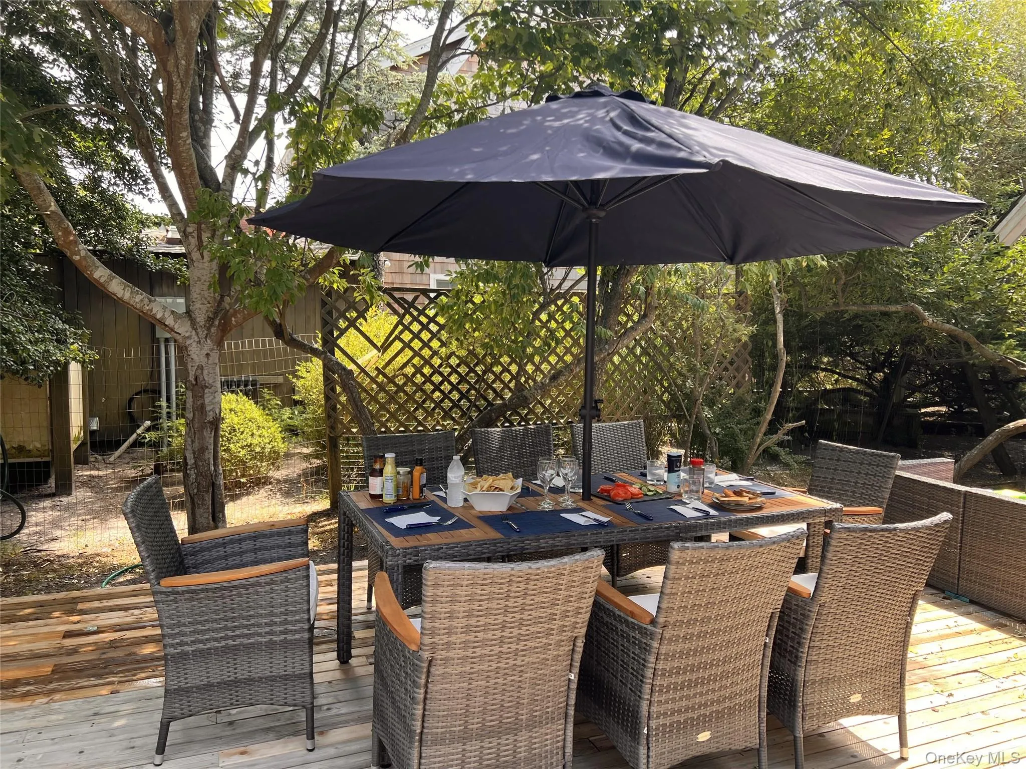 Wooden terrace with outdoor dining area Wooden terrace with outdoor dining area