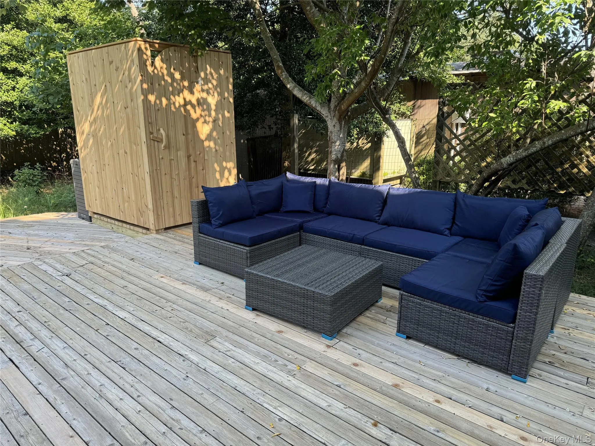Wooden deck with an outdoor living space Wooden deck with an outdoor living space