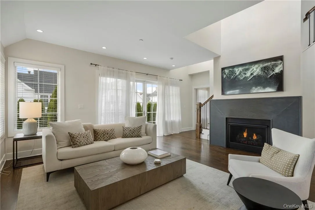 Gas Fireplace in Living Room; French Doors to Patio Gas Fireplace in Living Room; French Doors to Patio