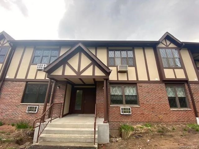 Tudor home with brick siding and stucco siding Tudor home with brick siding and stucco siding