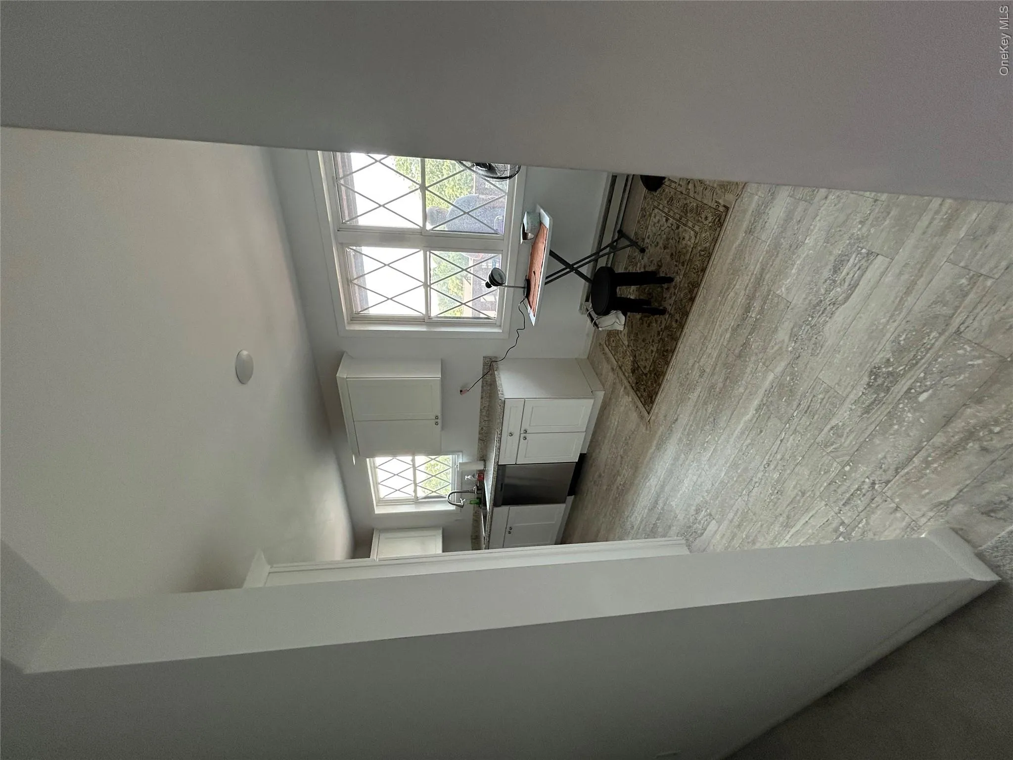 Dining space with light wood-style flooring and baseboard heating Dining space with light wood-style flooring and baseboard heating