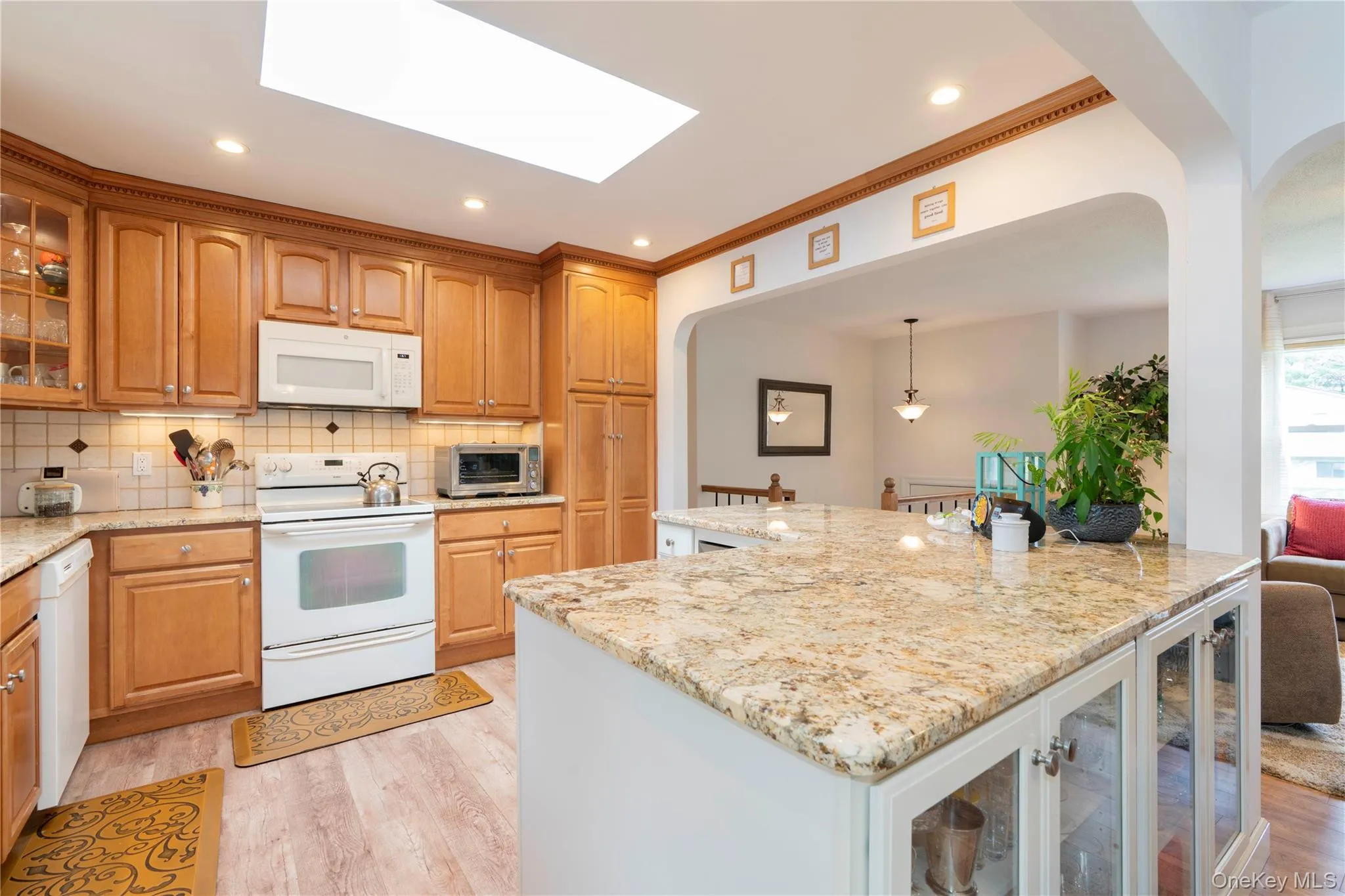 Kitchen has a skylight and is open to the living area Kitchen has a skylight and is open to the living area