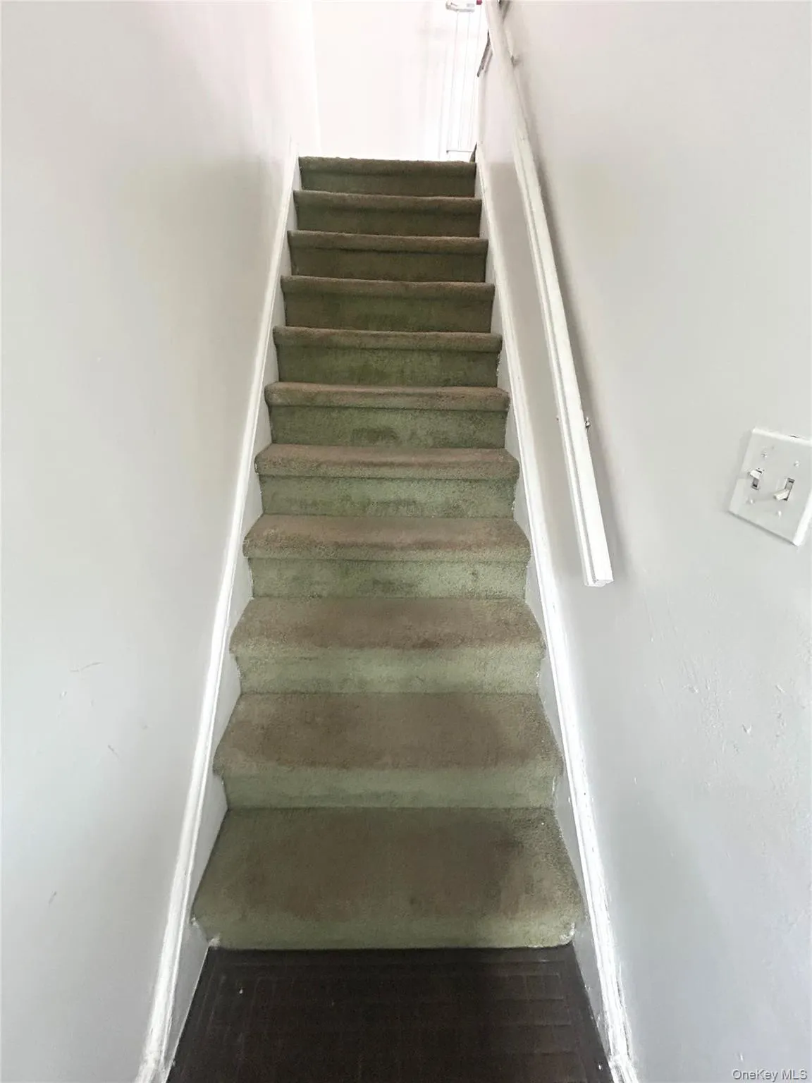 Stairs going to second floor apartment Stairs going to second floor apartment
