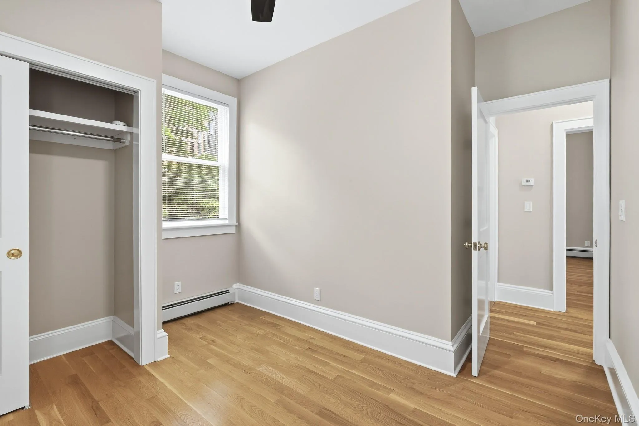 The second bedroom is a cozy space with plenty of natural light, storage, and can also be used as an office. The second bedroom is a cozy space with plenty of natural light, storage, and can also be used as an office.