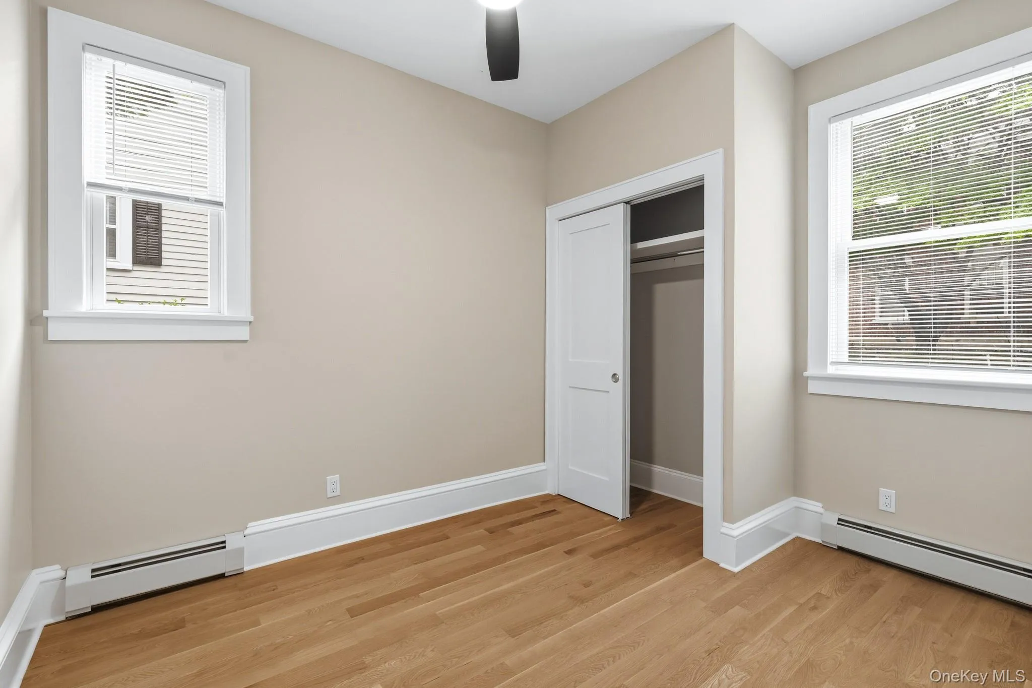 The second bedroom is a cozy space with plenty of natural light, storage, and can also be used as an office. The second bedroom is a cozy space with plenty of natural light, storage, and can also be used as an office.