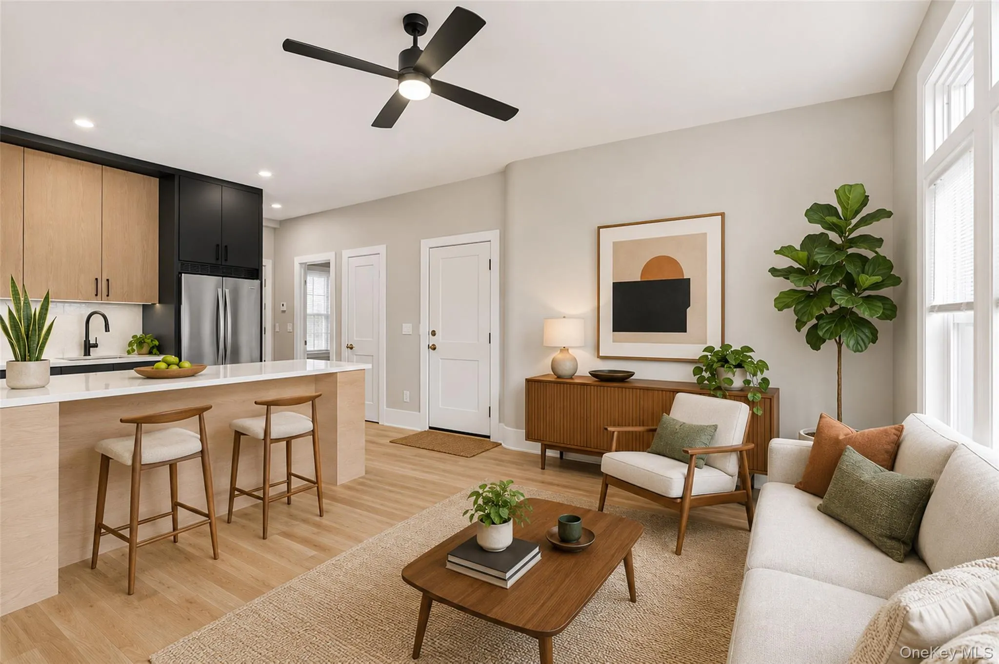 Virtually Staged Open concept living room and kitchen features stunning wood floors, bar and breakast nook, galley chef's kitchen. Virtually Staged Open concept living room and kitchen features stunning wood floors, bar and breakast nook, galley chef's kitchen.