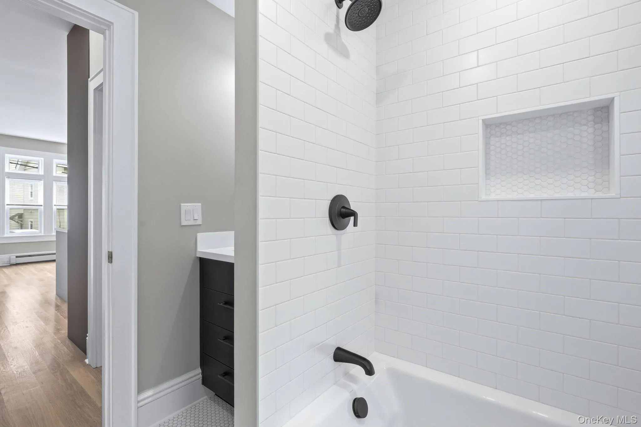 The bathroom sits between the two bedrooms and features natural light as well as beautiful lighting. The designer tiling on the brand new bathroom sparkle in your new oasis. It's all in the details! The bathroom sits between the two bedrooms and features natural light as well as beautiful lighting. The designer tiling on the brand new bathroom sparkle in your new oasis. It's all in the details!